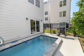 A residential swimming pool with a clear blue water surface, surrounded by a concrete deck. - 🌊 Villas Laguna #8 - Beach Retreat, Pool, Rooftop Terrace, Pets! (Panama City Beach)
