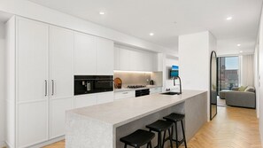 Fridge, microwave, oven, stovetop - 3BR Coastal Escape with Ocean Views, Shared Pool & Jacuzzi, 2 Car Spaces & Walk to Surf Beach (Kiama)