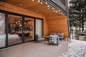 Terrace/patio - Family mountain retreat with jacuzzi, sauna, playground, and stunning forest views. (Sunger)
