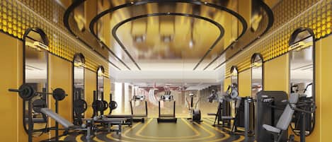 A gym with exercise equipment, a mirrored wall, and a yellow and black color scheme.