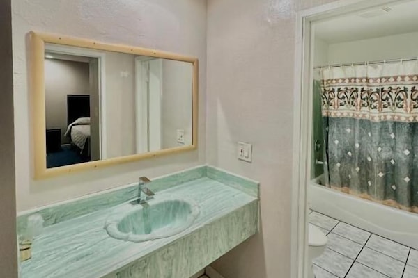 Bathtub, free toiletries, towels, soap