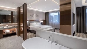 A modern hotel room with a large bed, a separate bathroom with a bathtub, a vanity with a mirror, and a large window with curtains. - Giorgio Morandi Hotel - Jinan Jiefang  (Jinan)