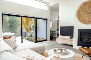 TV, fireplace, offices - Super-Styled, Light-Filled Eco Home (Torquay)