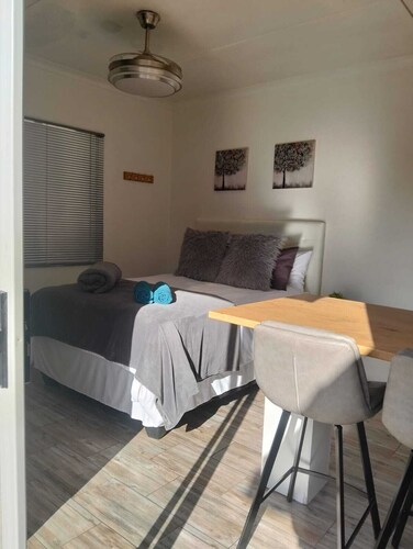 Cozy and stylish1-bedroom unit feature a comfortable double bed,bathroom,kitchen