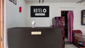A reception desk labeled 'Reception' with a 'HOTEL' sign above it.