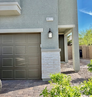 A residential building with a garage, a stone accent wall, and a mailbox. - Modern Las Vegas Getaway, Close to all the Fun!! (Las Vegas)
