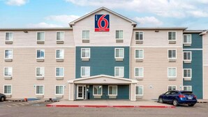 A 6 Suites hotel with a central entrance, multiple floors, and a parking area. - 2 Queen Beds |Non-Smoking, Kitchen (El Paso TX)