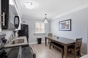 Private kitchen - Elegant 2BR on Frenchmen Street with shared pool, hot tub, and easy walk to the French Quarter. (New Orleans)