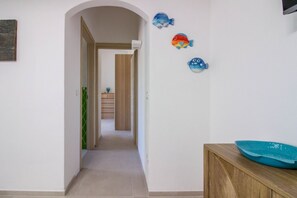 Interior - GuestHost - Cozy and bright 70 square meters apartment, perfect for four people, located on the first floor of a building without an elevator.The property enjoys an excellent location, in an extremely quiet area and just 250 meters from the seafront. Ame (Cannigione)
