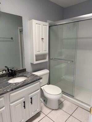 Shower, hair dryer, towels, soap