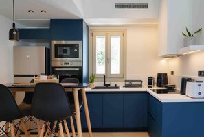 Luxury Apartment, Kitchen, Partial Sea View | Private kitchen | Full-size fridge, oven, stovetop, cookware/dishes/utensils - APADEMIA SKYROS (Skiros)