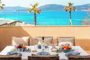 Outdoor dining - ClickSardegna Grand Sunset Penthouse with 2 Seafront Terraces & Private Garage (Alghero)