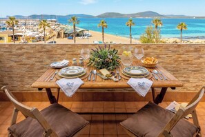 Outdoor dining - ClickSardegna Grand Sunset Penthouse with 2 Seafront Terraces & Private Garage (Alghero)