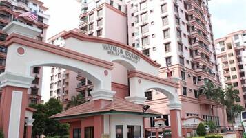 A multi-story building with a prominent archway labeled 'MARINA COURT RESORT.'