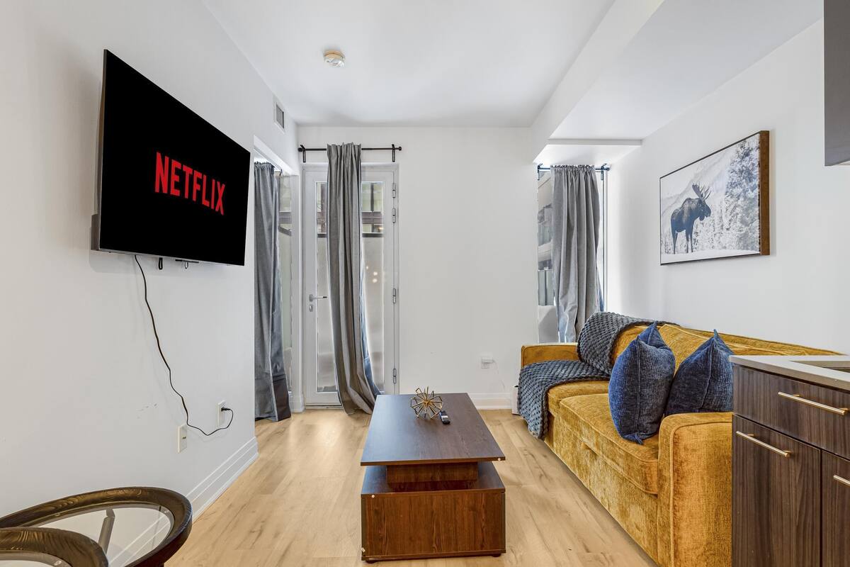 Suite Club, letti multipli | Area soggiorno