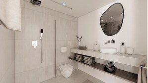 Ein modernes Badezimmer mit bodengleicher Dusche, Toilette, Waschbecken mit Spiegel und Handtuchhalter.