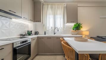 Fridge, coffee/tea maker, electric kettle, cookware/dishes/utensils
