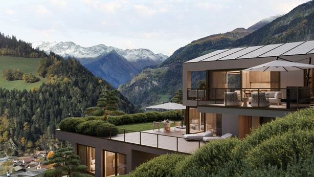 A modern two-story house with a balcony overlooking a mountainous landscape. - Chalet Aris (Sankt Leonhard in Passeier)