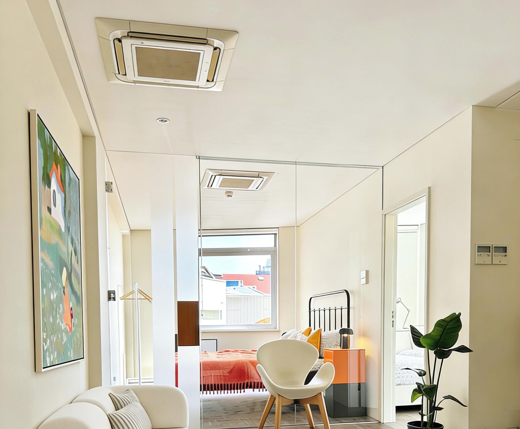 A modern interior with a sofa, a chair, a bed, and a potted plant.