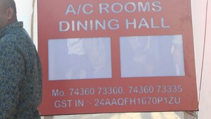 A sign for Hotel Akash Palace with A/C rooms and a dining hall. - Hotel Akash Palace  (Kotda Sangani)