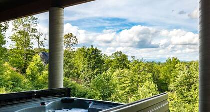 Spacious private mountain retreat featuring a king bedroom with twin bunks, office with futon, full bath, washer/dryer, large kitchenette, and comfortable living area. Relax in your private hot tub, screened porch, and peaceful yard setting.