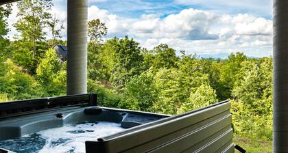 Spacious private mountain retreat featuring a king bedroom with twin bunks, office with futon, full bath, washer/dryer, large kitchenette, and comfortable living area. Relax in your private hot tub, screened porch, and peaceful yard setting.