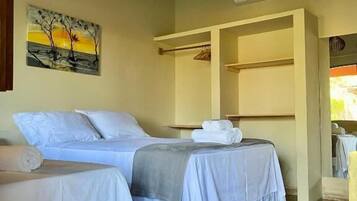 Family Suite, Garden View | Desk, laptop workspace, blackout curtains, iron/ironing board