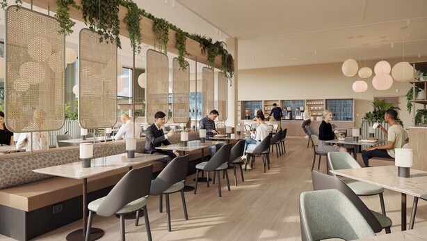 Un caffè moderno con posti a sedere, tra cui tavoli e banconi, e una zona bancone.