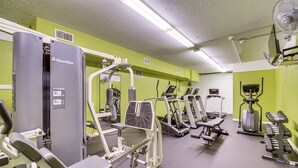 A gym with Nautilus equipment, treadmills, and weight machines. - Waterfront Resort Home! Extended Jensen Beach Stay (Jensen Beach)