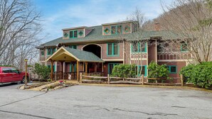 A large, two-story house with a porch, a garage, and a driveway. - Forest-view Balcony & Trail Access! Burnsville Gem (Burnsville)
