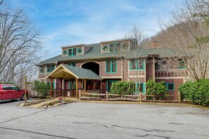 A large, two-story house with a porch, a garage, and a driveway. - Forest-view Balcony & Trail Access! Burnsville Gem (Burnsville)