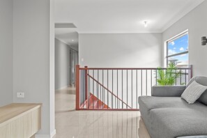 Apartment | Living room - Brand New Riverfront Home, Pool and Sunrise Views (Griffin)