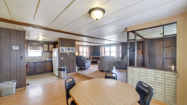 A compact living space with a kitchen, dining area, and seating. - Outdoor Adventure Base in the Heart of Miller (Miller)