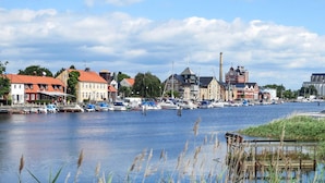 A riverside town with historic buildings, a marina, and a bridge. - 4 Star Holiday Home in Yngsjo, Sverige (Yngsjo)