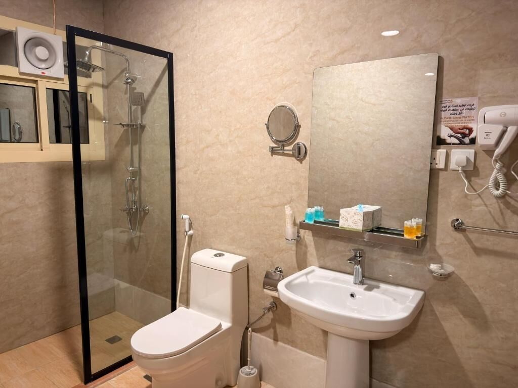 Separate bathtub and shower, hair dryer, towels, soap