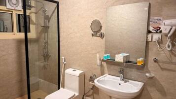 Separate bathtub and shower, hair dryer, towels, soap