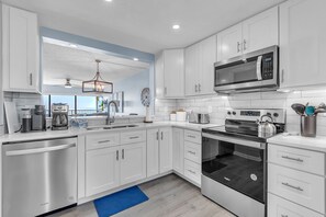 Fridge, microwave, oven, stovetop - ☀Stunning Views🐬Beachfront Condo🌴Ocean Sands II-602🐠Heated Pool/Hot Tub/Grills (Madeira Beach)