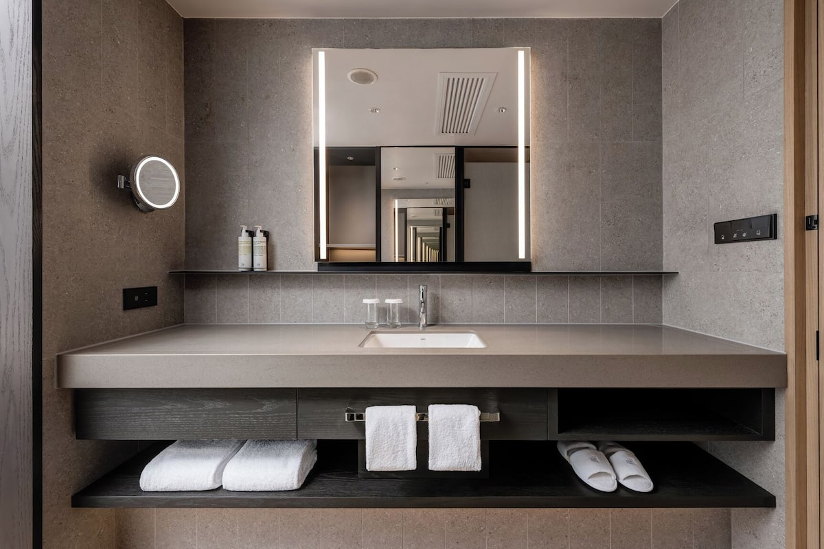 Bathroom | Hair dryer, slippers, towels, shampoo