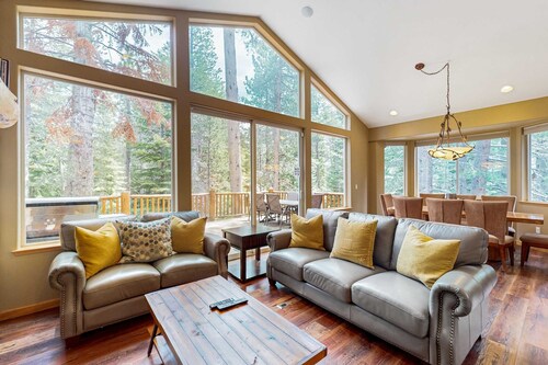 Upscale house with 2 living areas, open layout, hot tub, backyard, & luxe suite