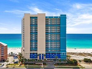 A multi-story hotel with balconies, a beach view, and a parking area. - Beachfront 2BR Condo at Palazzo 806 | Gulf Views | Balcony | Resort Pool (Panama City Beach)