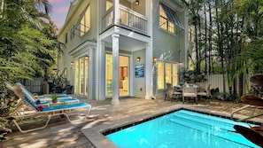 A two-story house with a swimming pool, outdoor seating, and a covered patio area. - **THE ELEGANT EGRET @ OLD TOWN** Home & Pool + Last Key White Glove Service... (Key West)