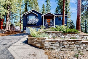 A two-story house with a stone retaining wall, a front porch, and a garage. - Skiing, Hiking & Biking' (South Lake Tahoe)