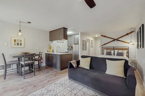 A compact living space with a kitchenette, a dining area, a sofa, and a bed. - Cozy Studio with Full Kitchen, Grill, Fireplace w/Access to Pool, Spa, Game Room (Tahoe Vista)