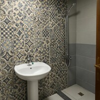 Premium Quadruple Room, Pool View | Bathroom | Shower, free toiletries, towels, soap