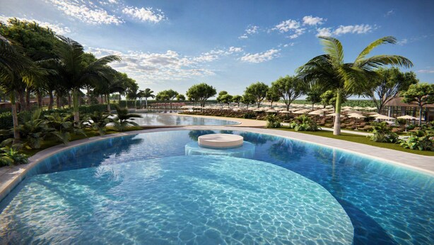 A large outdoor swimming pool with a circular water feature, surrounded by palm trees and lounge chairs. - Delta Open Air Resort (Porto Garibaldi)
