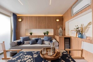 Casa de campo Confort, vista al jardín | Área de sala de estar