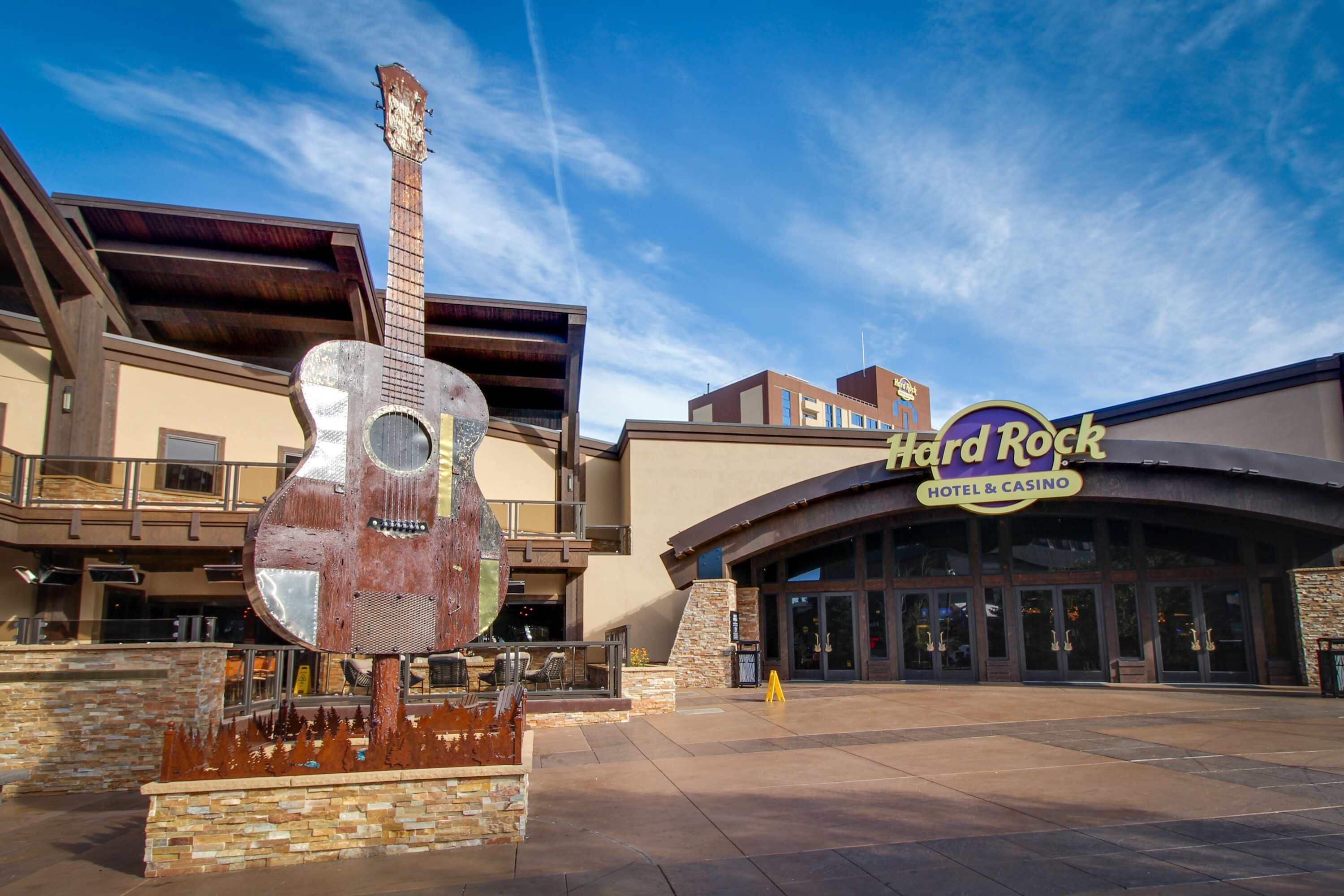 A Hard Rock Hotel & Casino with a large guitar sculpture in front.