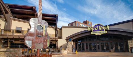 A Hard Rock Hotel & Casino with a large guitar sculpture in front.