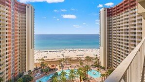 A high-rise hotel with a pool, beach view, and multiple balconies. - Shores of Panama 1416~2 Bdrm~sleeps 6 (Panama City Beach)