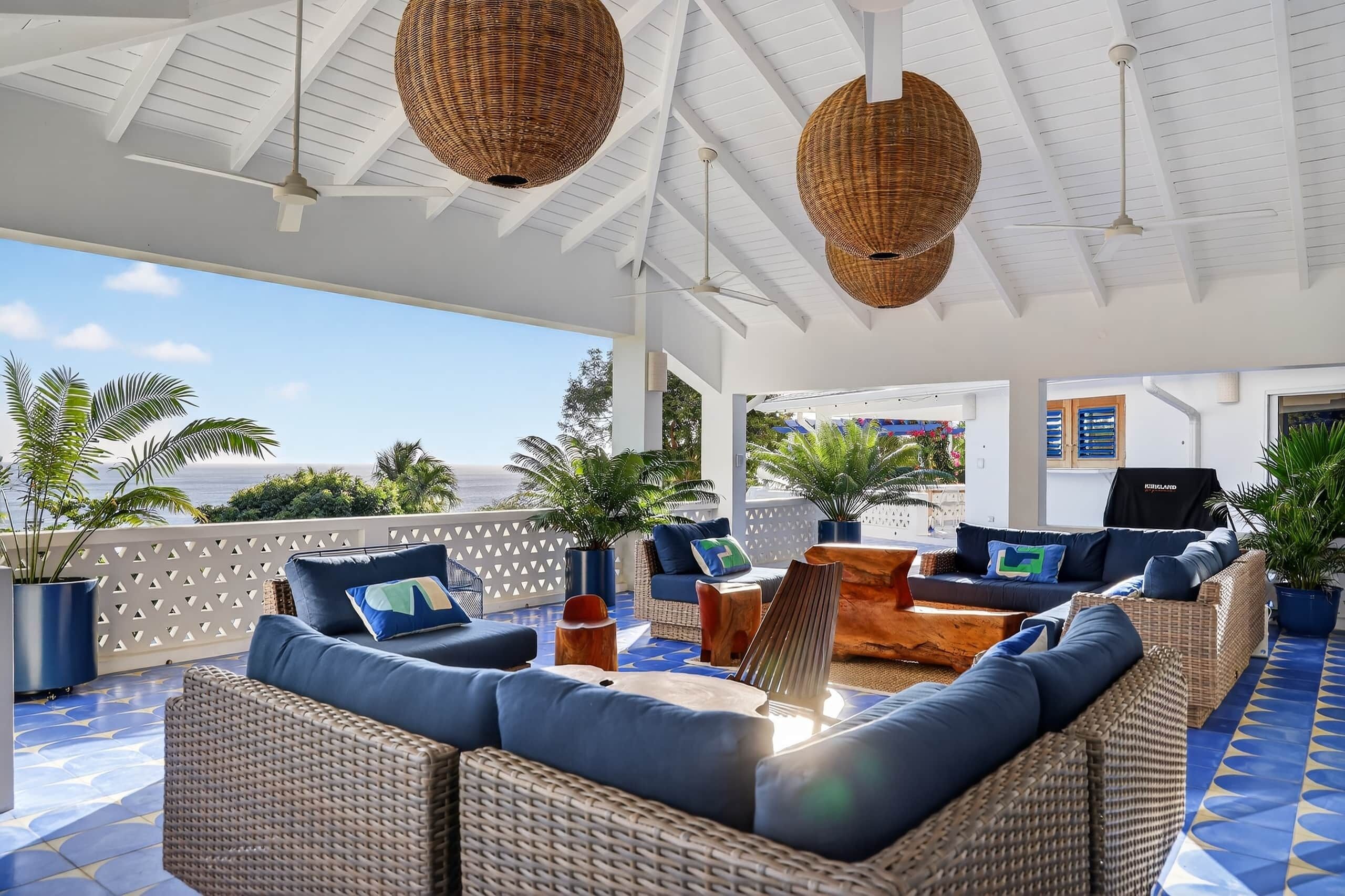 Main patio offering stunning views of the beach, perfect for relaxation and outdoor gatherings.